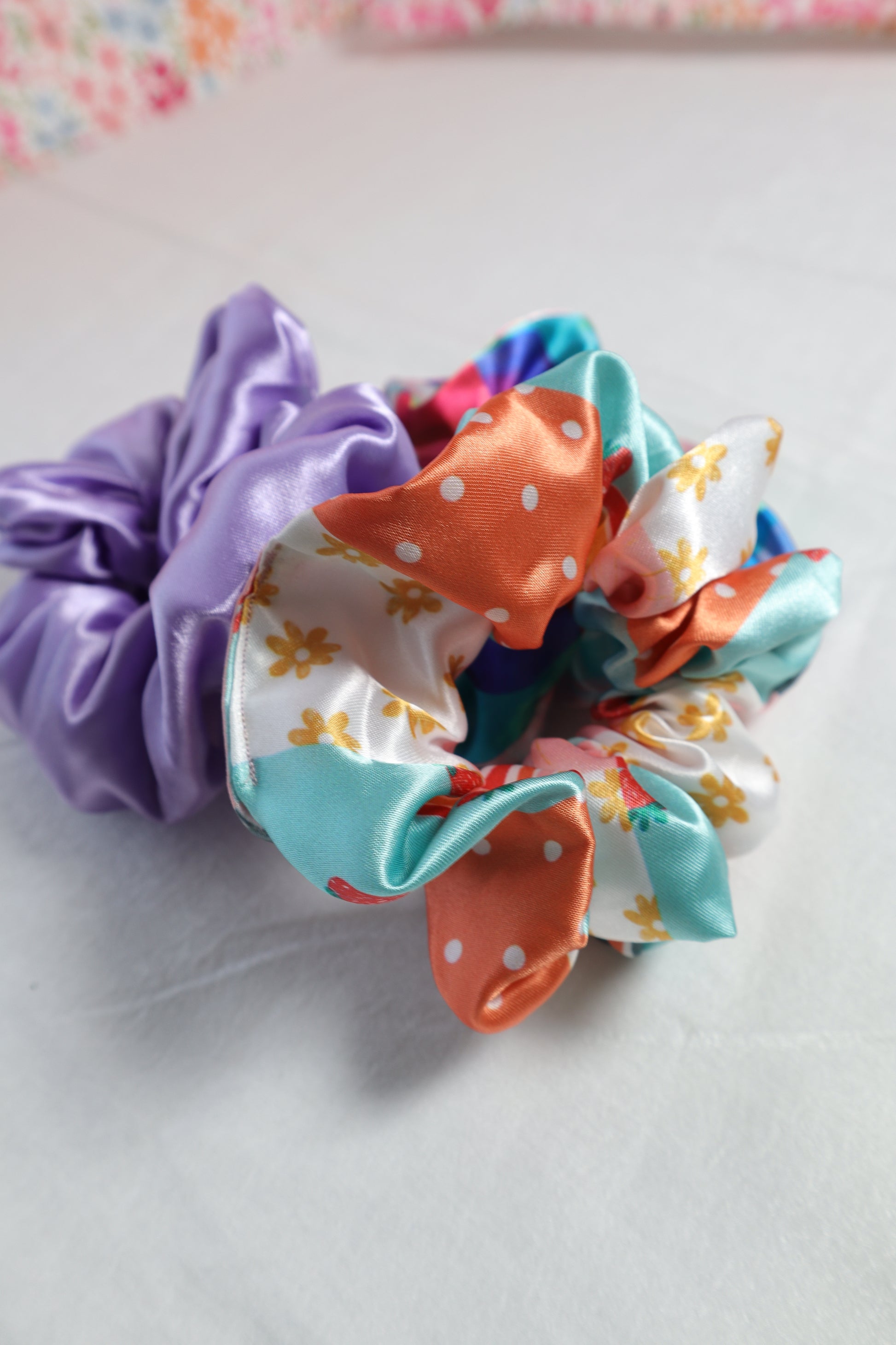 scrunchie, hair care, hair accessories, satin, hair protection, accessories, purple, lavender, girly, poly satin, orange, white, flowers